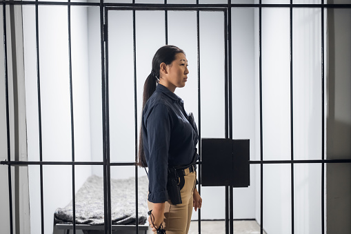 Woman Correctional Administrator walking through prison